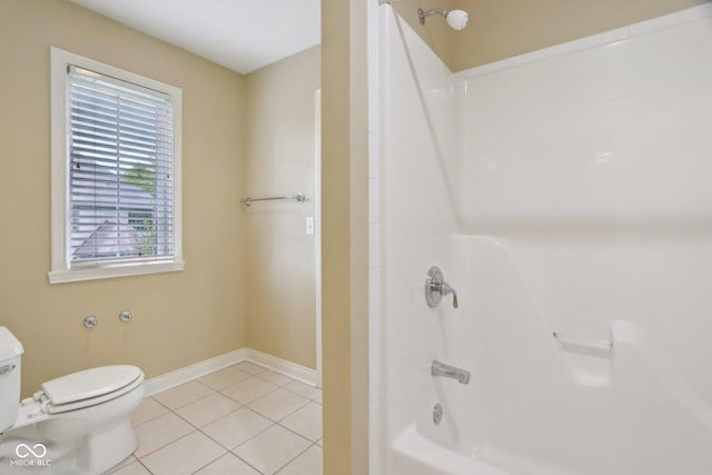 full bathroom with toilet, tile patterned floors, baseboards, and shower / washtub combination