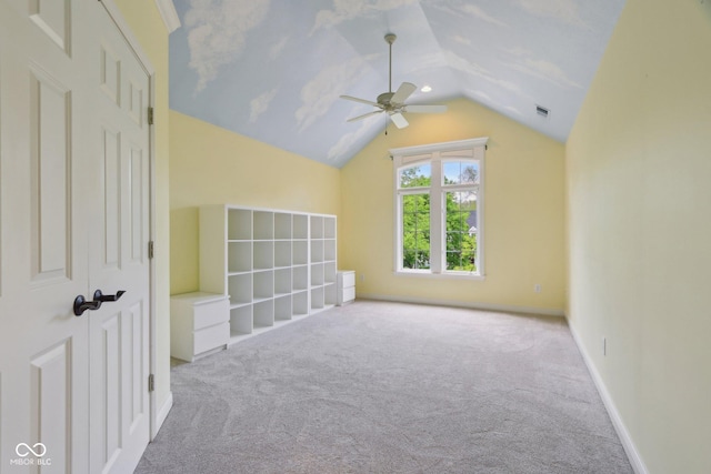 bonus room with lofted ceiling, ceiling fan, carpet, and baseboards