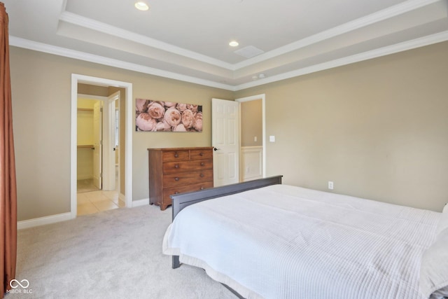 bedroom featuring light carpet, a tray ceiling, ornamental molding, recessed lighting, and baseboards