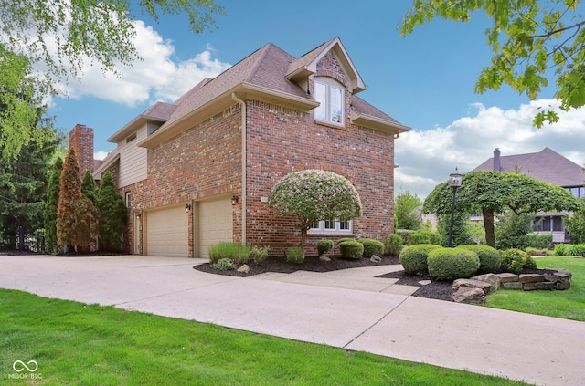 view of property exterior with brick siding, an attached garage, roof with shingles, and driveway