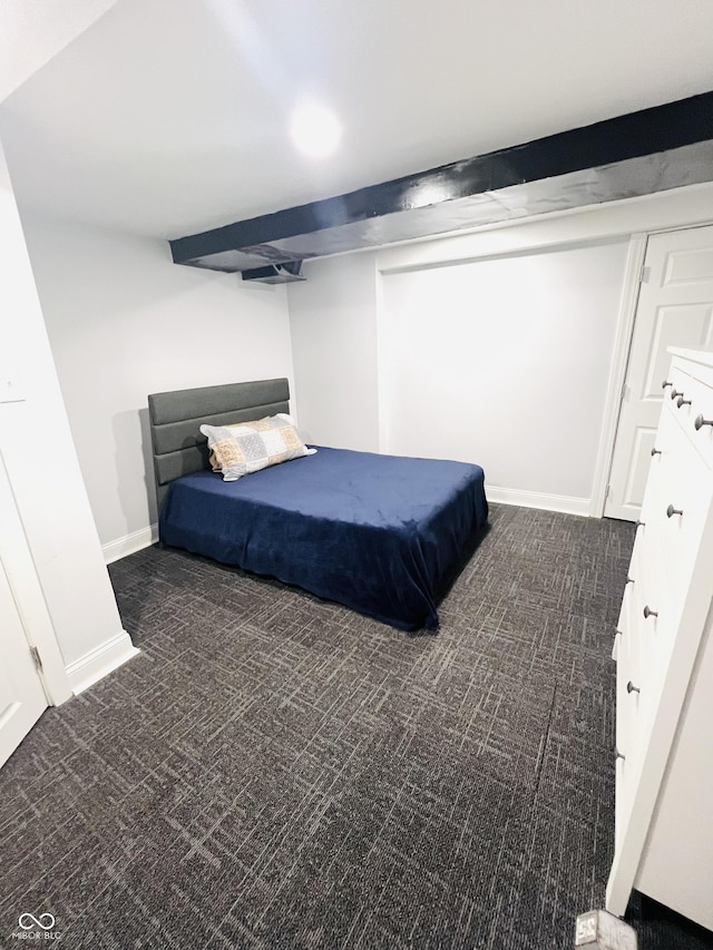 carpeted bedroom featuring baseboards