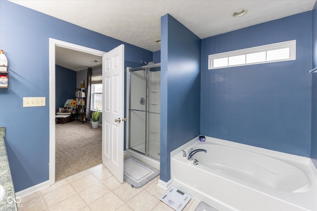 full bath with baseboards, a garden tub, a shower stall, and a textured ceiling