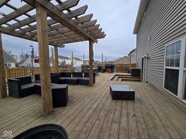 deck with fence, an outdoor living space, and a pergola