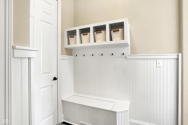 mudroom featuring wainscoting