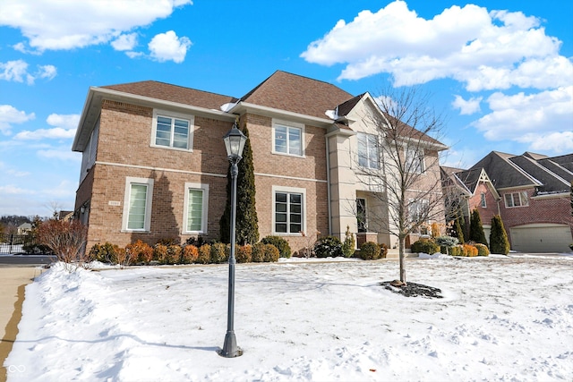 traditional-style house with brick siding