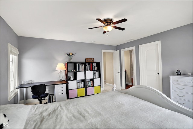 bedroom featuring visible vents, baseboards, and ceiling fan