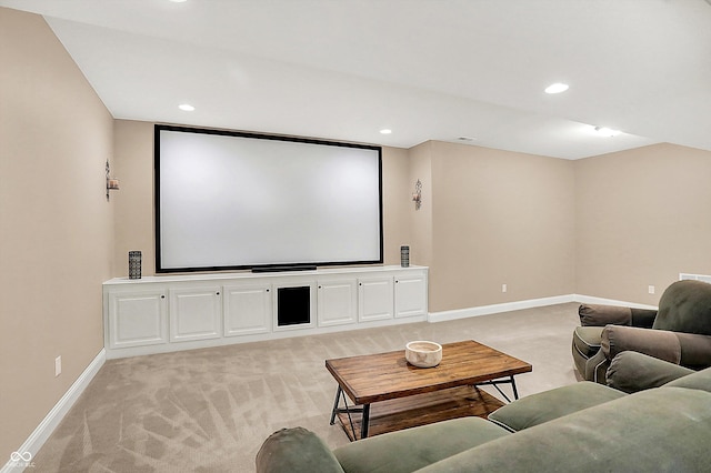 home theater with recessed lighting, light colored carpet, and baseboards