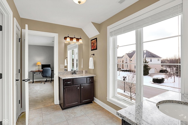 bathroom featuring vanity, tile patterned floors, and a wealth of natural light