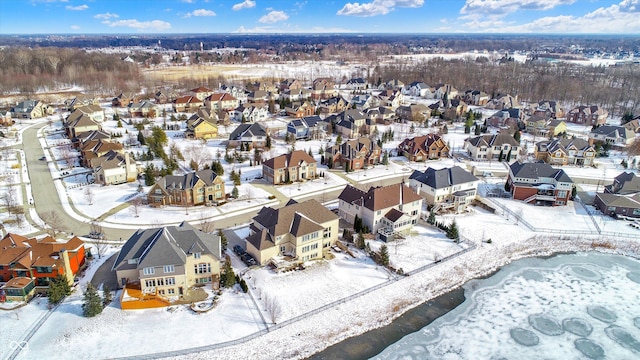 snowy aerial view featuring a residential view