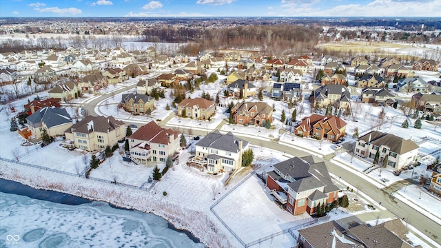 snowy aerial view featuring a residential view