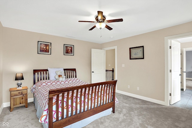 bedroom with a ceiling fan, carpet, and baseboards