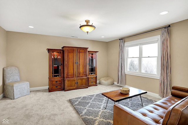 living room with light carpet, visible vents, recessed lighting, and baseboards