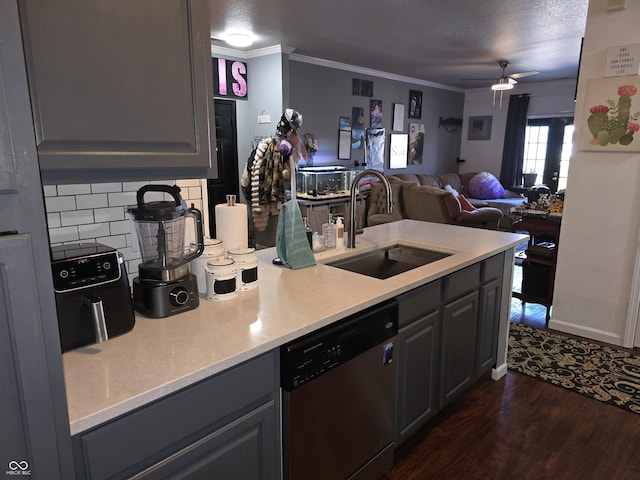 kitchen featuring open floor plan, dark wood-style flooring, crown molding, stainless steel dishwasher, and a sink