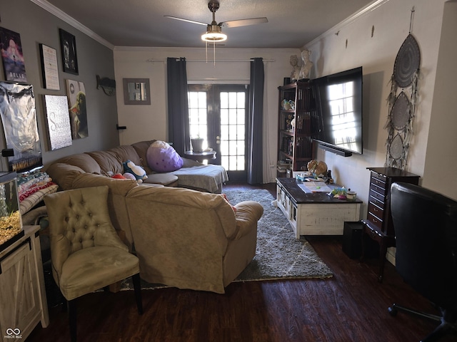 living area with french doors, ornamental molding, wood finished floors, and a ceiling fan