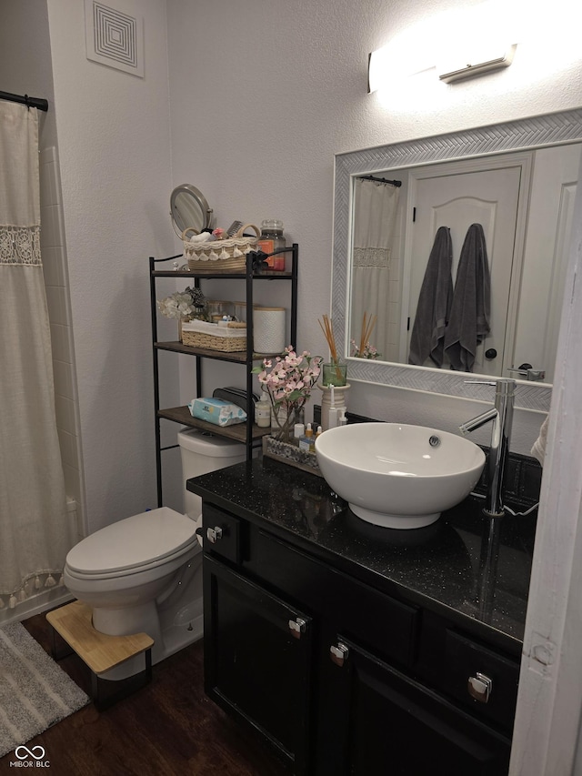 full bathroom featuring vanity, wood finished floors, toilet, and a shower with curtain