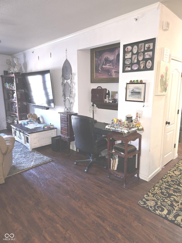 office area with ornamental molding and wood finished floors