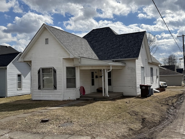 view of front of home featuring a porch and roof with shingles