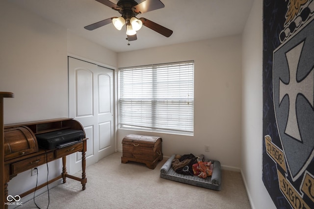 interior space featuring carpet floors, ceiling fan, and baseboards