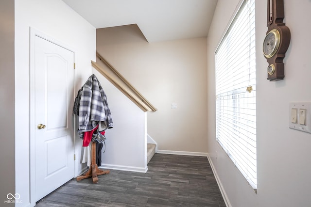 interior space featuring wood finished floors and baseboards