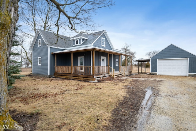 view of front of home with a porch, a garage, board and batten siding, a carport, and driveway