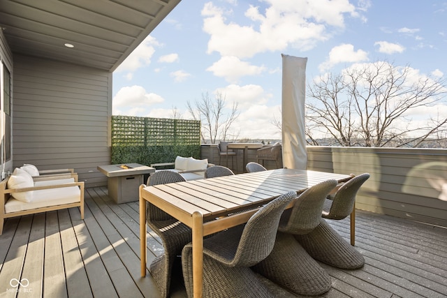 deck featuring outdoor dining area