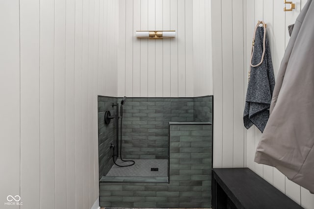 bathroom with a tile shower