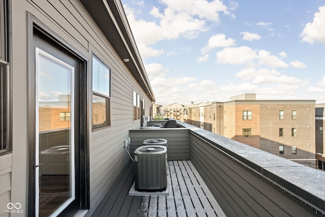 balcony with a residential view and central AC unit