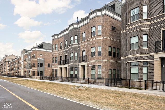 view of building exterior with fence