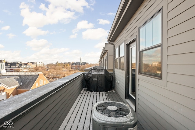 balcony with a grill and central air condition unit