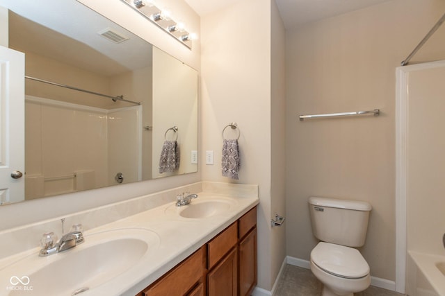 full bath featuring toilet, double vanity, visible vents, and a sink