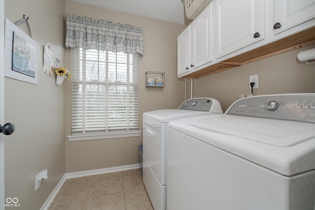 laundry room with washer and dryer, cabinet space, baseboards, and light tile patterned floors