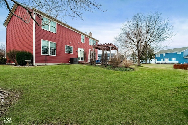 rear view of house with cooling unit, a chimney, a lawn, and a pergola