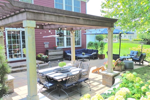 view of patio / terrace with outdoor dining space, a pergola, and an outdoor hangout area