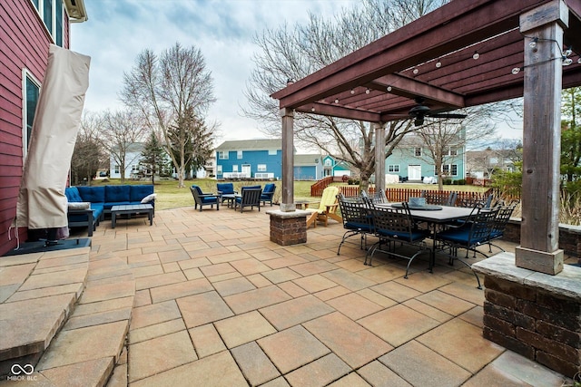 view of patio featuring a ceiling fan, outdoor dining space, an outdoor living space with a fire pit, and a pergola