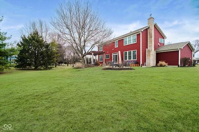 exterior space featuring a lawn and a chimney