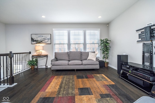 living room featuring recessed lighting, wood finished floors, and baseboards