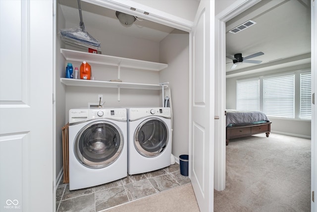 clothes washing area featuring laundry area, separate washer and dryer, visible vents, and carpet floors