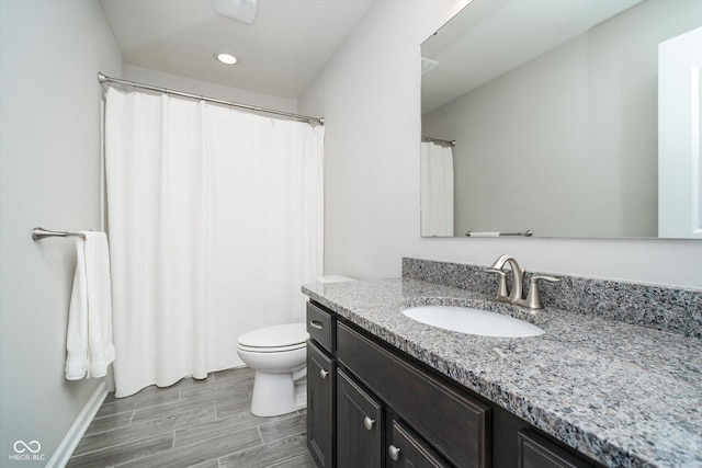 full bathroom featuring vanity, toilet, recessed lighting, and wood finish floors