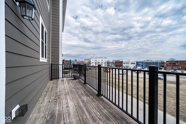 wooden terrace featuring a view of city