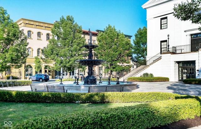 view of home's community featuring stairway