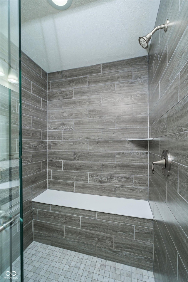 full bathroom featuring a shower stall