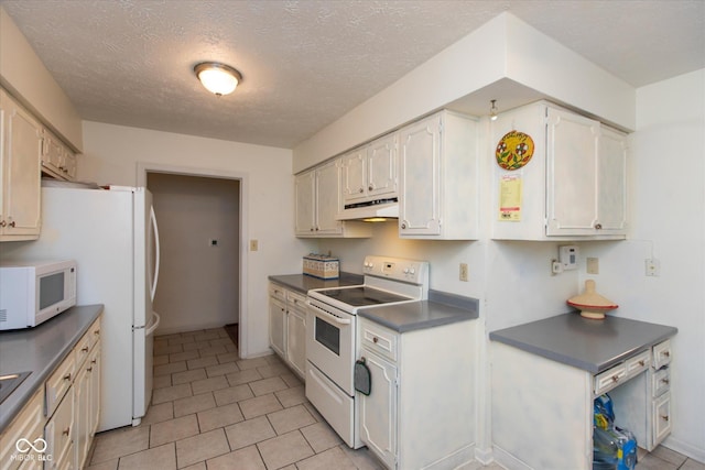 1612 Westbay Ct, Indianapolis, IN 46260 - kitchen featuring white appliances, under cabinet range hood, dark countertops, light tile patterned floors, and a textured ceiling
