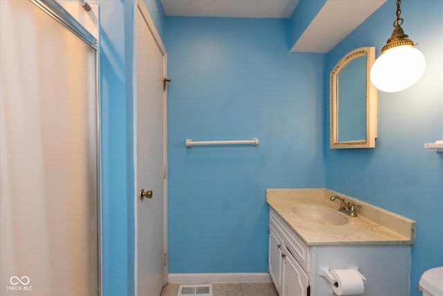 1612 Westbay Ct, Indianapolis, IN 46260 - bathroom featuring vanity, toilet, tile patterned floors, and baseboards