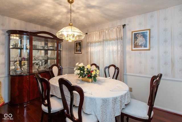 1612 Westbay Ct, Indianapolis, IN 46260 - dining space featuring a chandelier, wood finished floors, and wallpapered walls