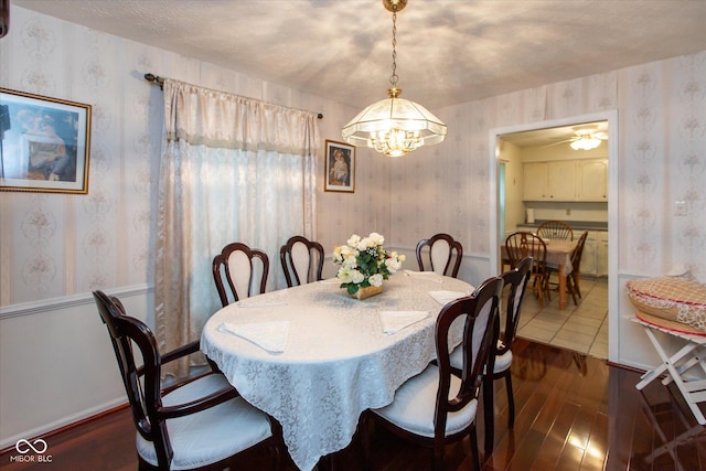 1612 Westbay Ct, Indianapolis, IN 46260 - dining room with wallpapered walls, dark wood-style floors, and a chandelier