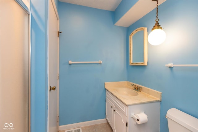 1612 Westbay Ct, Indianapolis, IN 46260 - half bath featuring toilet, vanity, tile patterned flooring, and baseboards