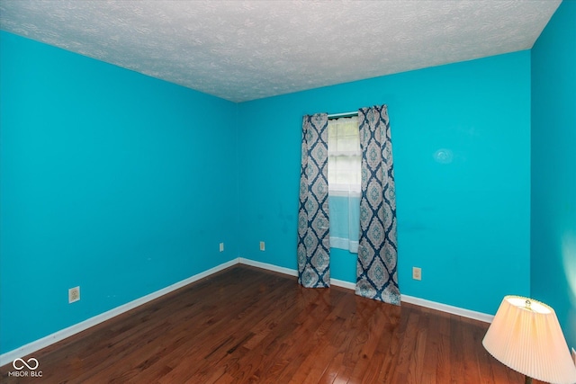 1612 Westbay Ct, Indianapolis, IN 46260 - empty room featuring a textured ceiling, wood finished floors, and baseboards
