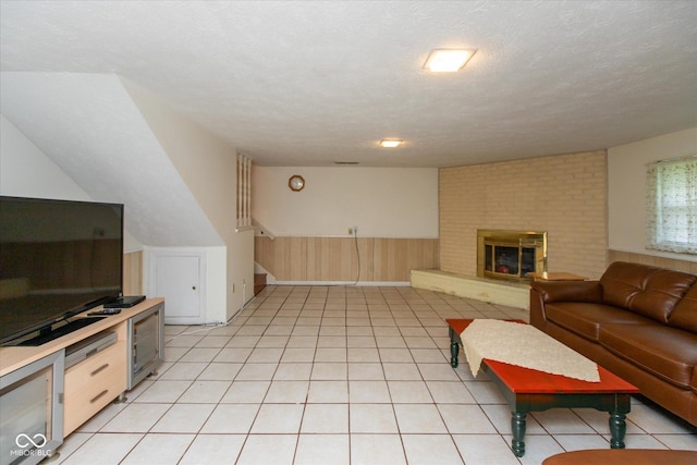 1612 Westbay Ct, Indianapolis, IN 46260 - living room with wainscoting, a fireplace, and a textured ceiling