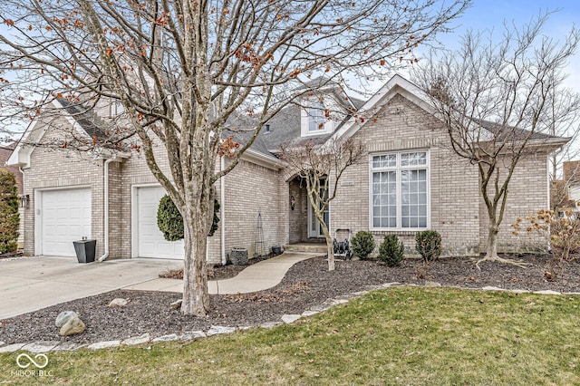 view of front of house featuring concrete driveway, brick siding, and an attached garage