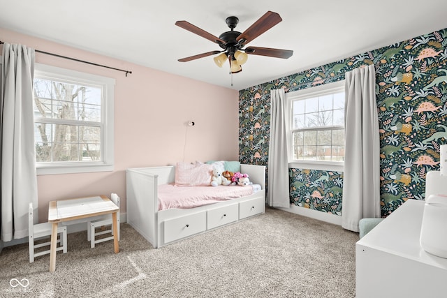 carpeted bedroom featuring ceiling fan, wallpapered walls, and baseboards